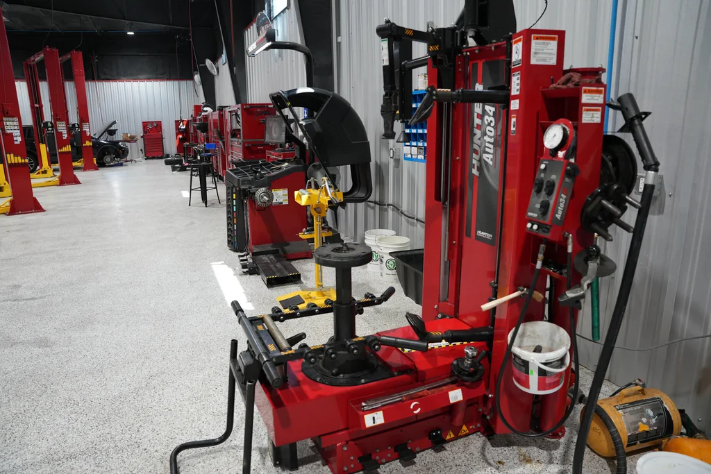Tire-changing and wheel-balancing equipment in the service workshop.